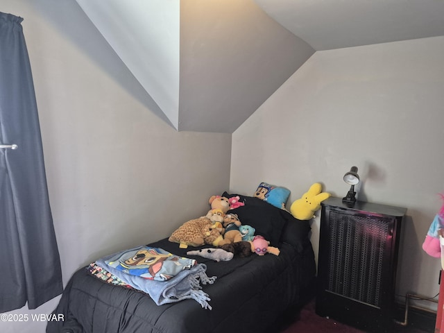 bedroom featuring lofted ceiling