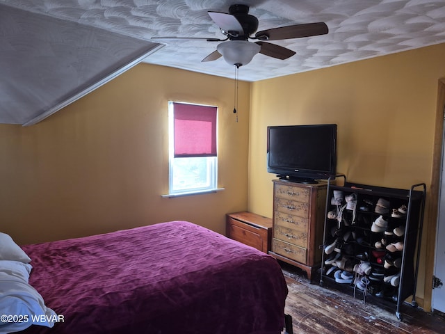 bedroom featuring a ceiling fan and wood finished floors