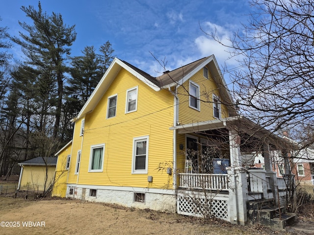 view of property exterior with covered porch