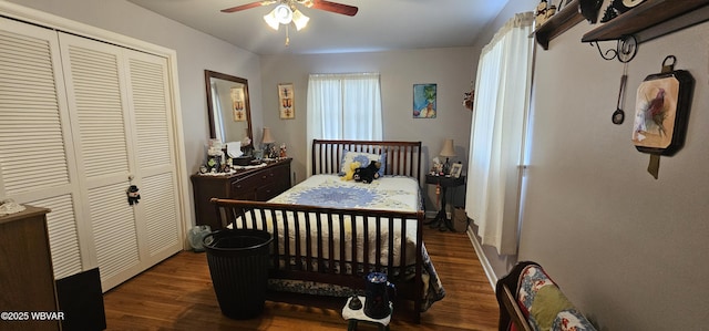 bedroom featuring dark hardwood / wood-style floors, ceiling fan, and a closet