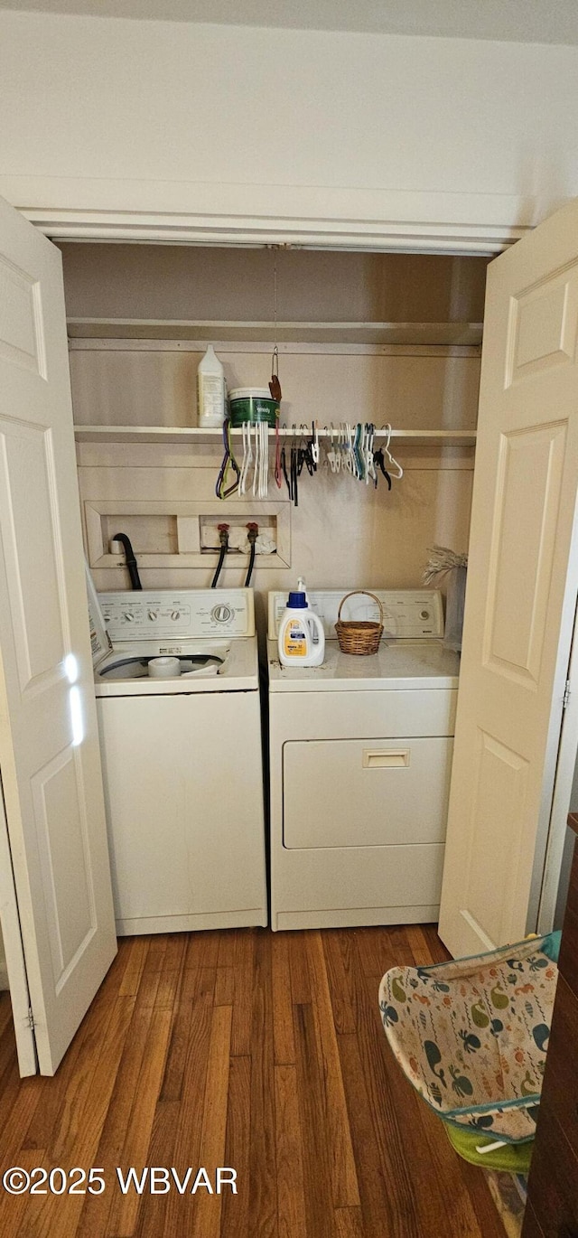 laundry room featuring hardwood / wood-style flooring and washing machine and dryer