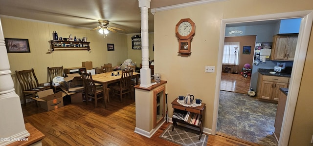 dining area featuring hardwood / wood-style floors, ornamental molding, and ceiling fan