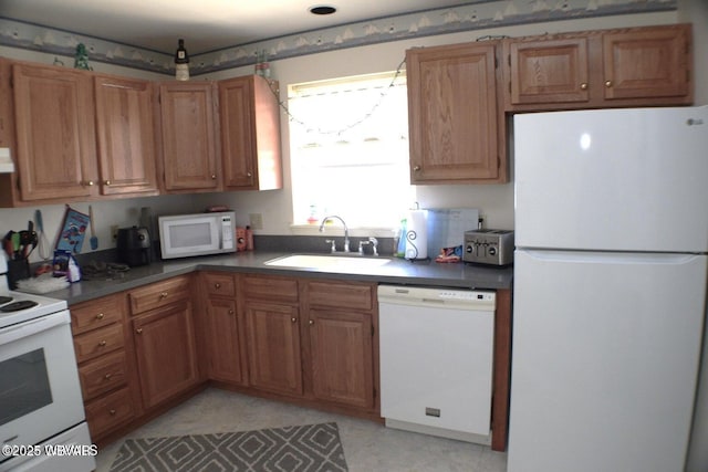 kitchen with sink and white appliances