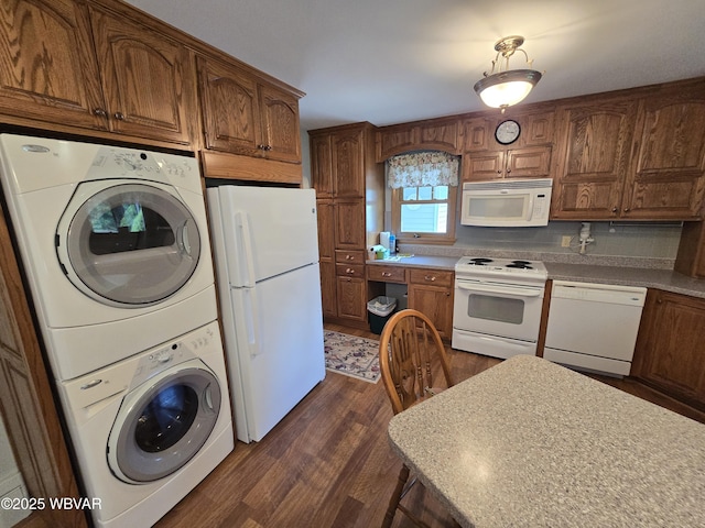 4401 Pine Mountain Rd, Jersey Shore, PA 17740 - kitchen featuring white appliances, stacked washer / dryer, dark wood-style flooring, brown cabinetry, and light countertops