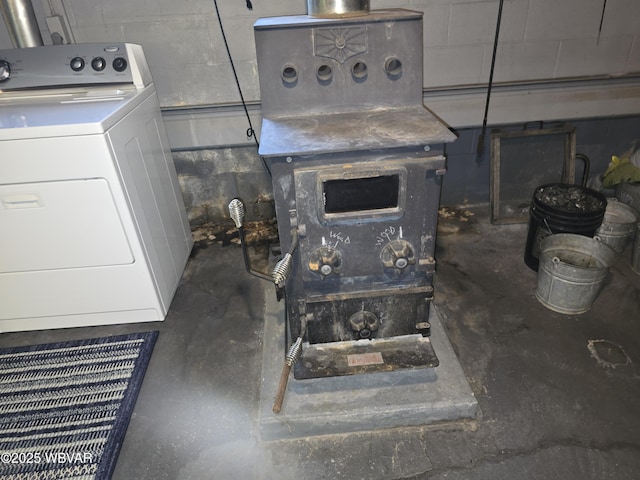 4401 Pine Mountain Rd, Jersey Shore, PA 17740 - detailed view of concrete block wall, unfinished concrete floors, and washing machine and dryer
