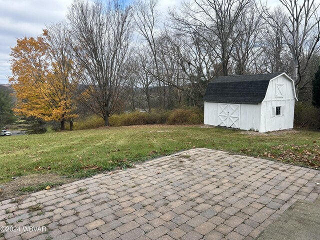 view of patio / terrace featuring a shed