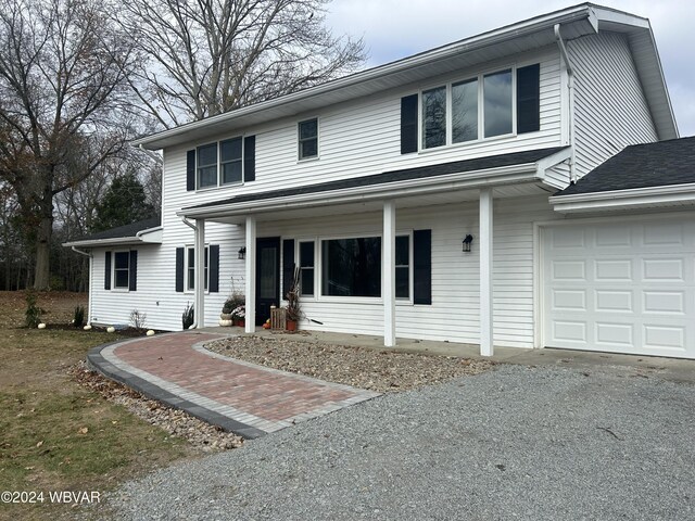 front of property with a garage