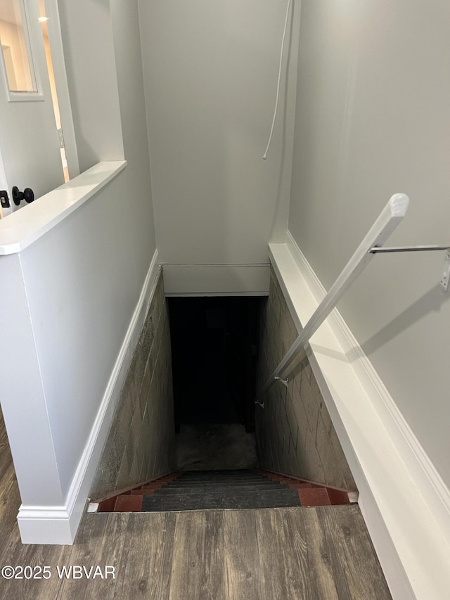 stairway featuring hardwood / wood-style flooring