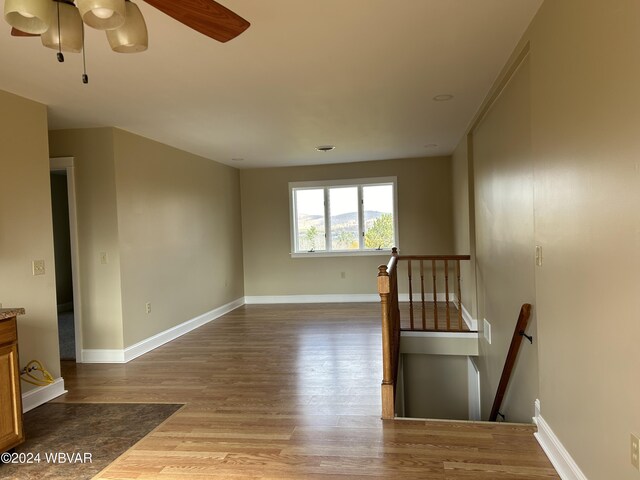 interior space featuring hardwood / wood-style flooring and ceiling fan