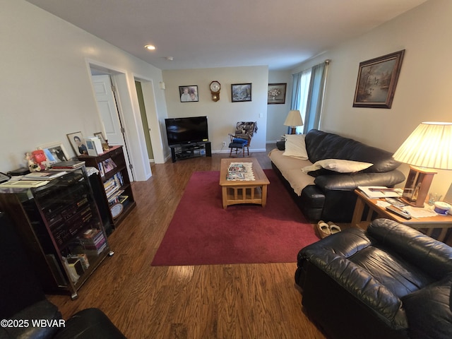 living room with dark hardwood / wood-style floors