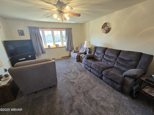 living room with visible vents, baseboards, carpet, and a ceiling fan