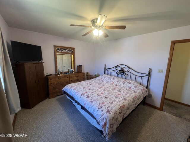 bedroom with ceiling fan, baseboards, and light carpet