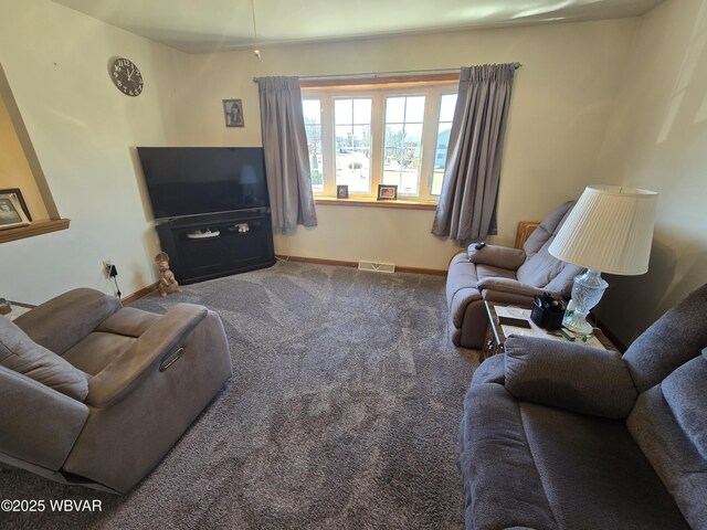 living area featuring visible vents, baseboards, and carpet floors