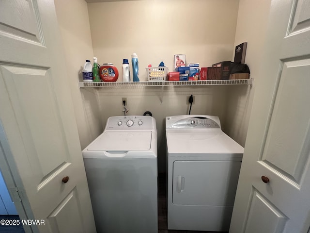 laundry room with separate washer and dryer and laundry area