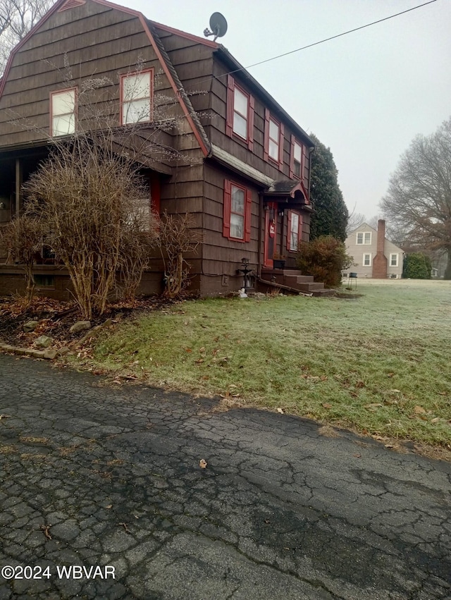 view of property exterior featuring a yard