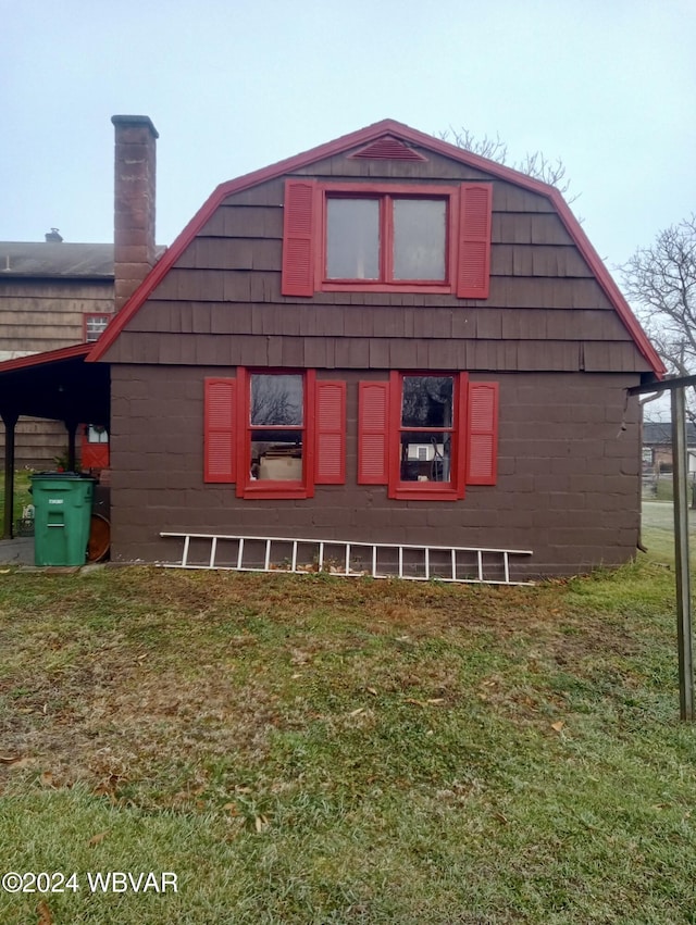 view of property exterior featuring a lawn