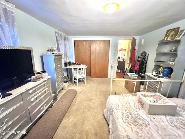 bedroom featuring a closet and carpet flooring