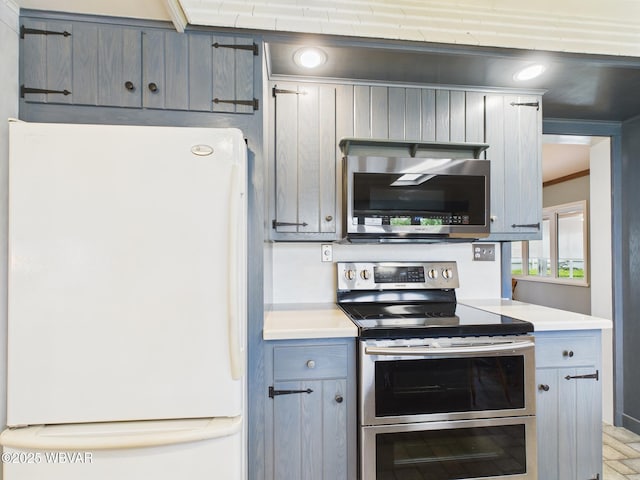 kitchen with stainless steel appliances and light countertops