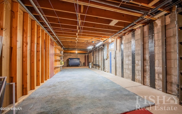 unfinished basement featuring heating fuel