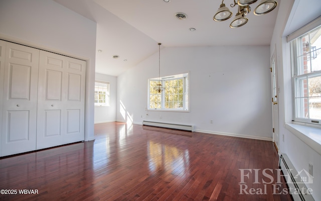 interior space featuring a baseboard radiator, vaulted ceiling, a notable chandelier, and dark wood finished floors