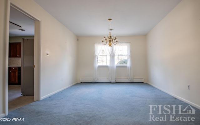 spare room featuring carpet, a baseboard radiator, baseboards, and an inviting chandelier