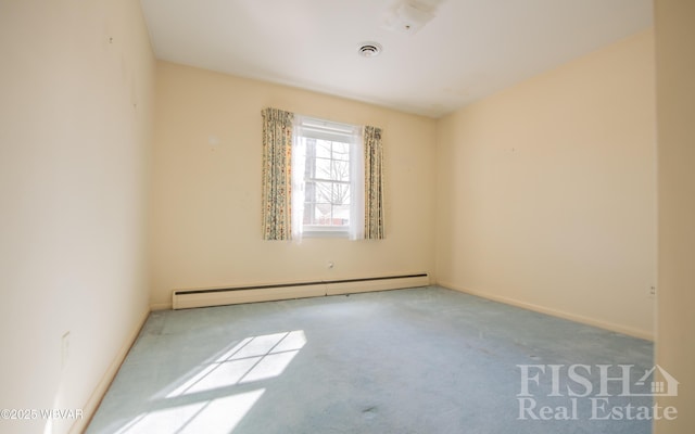 carpeted spare room with a baseboard radiator, visible vents, and baseboards