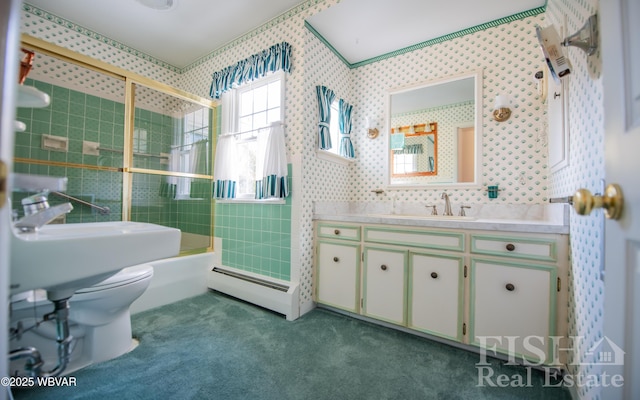 bathroom with enclosed tub / shower combo, toilet, vanity, baseboard heating, and wallpapered walls