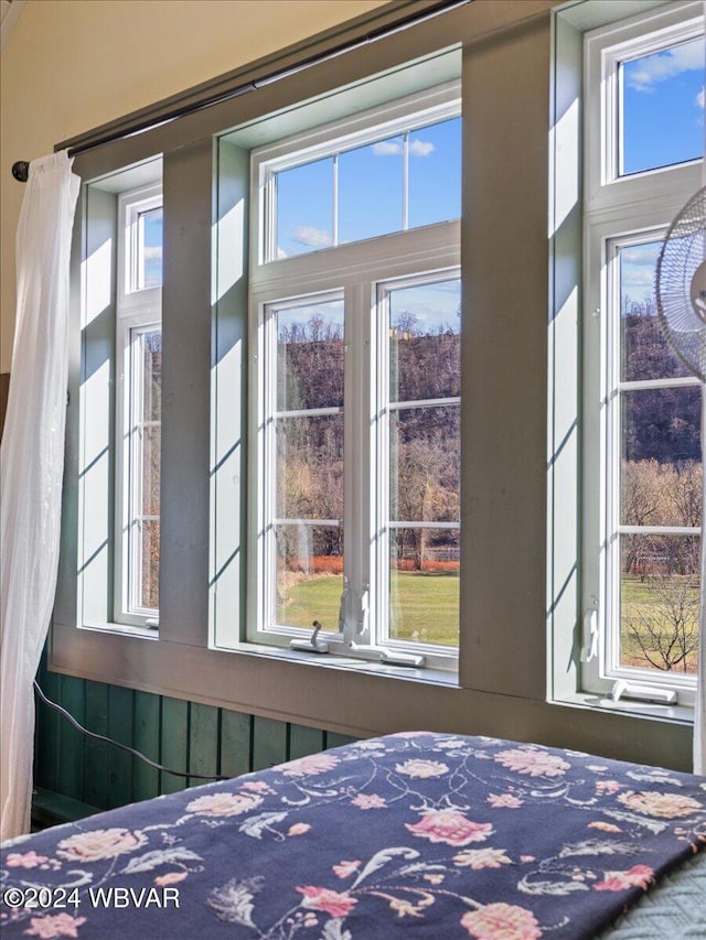 unfurnished bedroom featuring multiple windows