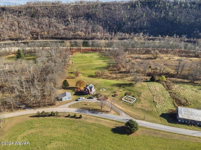 birds eye view of property with a rural view