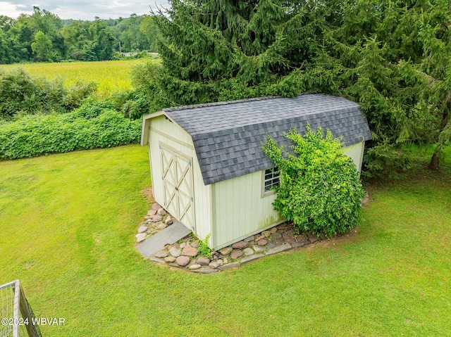 view of outdoor structure featuring a lawn