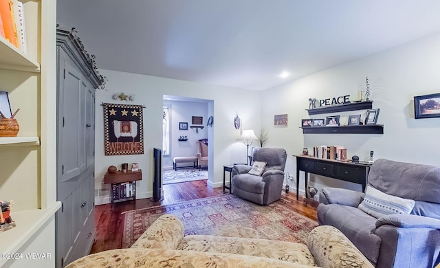 living room with dark wood-type flooring