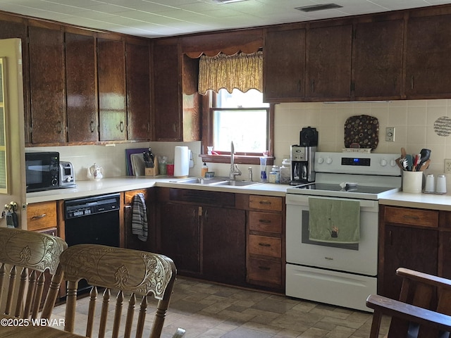 3510 Rt 184, Trout Run, PA 17771 - kitchen featuring black appliances, backsplash, light countertops, and dark brown cabinets