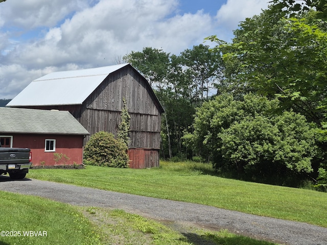3510 Rt 184, Trout Run, PA 17771 - view of home's exterior with a barn, an outdoor structure, and a lawn