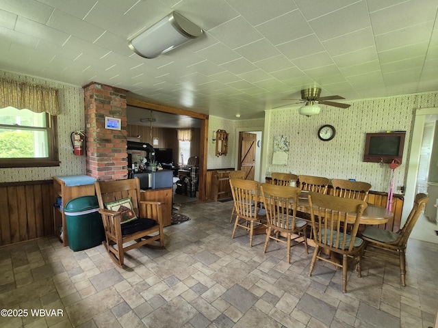 3510 Rt 184, Trout Run, PA 17771 - dining space featuring wallpapered walls, a ceiling fan, and stone tile floors
