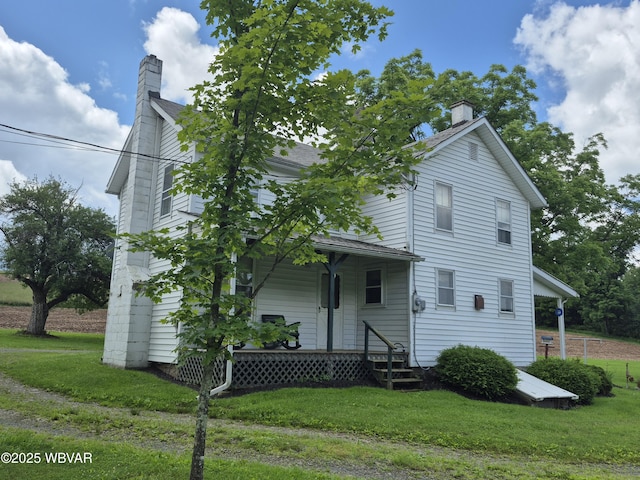 3510 Rt 184, Trout Run, PA 17771 - view of front of property featuring a chimney, a front yard, and a porch