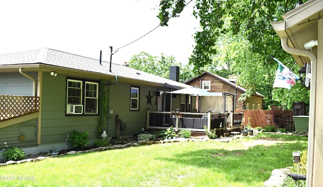 201 Richey St, Lock Haven, PA 17745 - back of property with a wooden deck, a shingled roof, and a chimney
