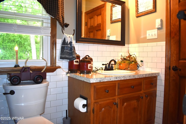 201 Richey St, Lock Haven, PA 17745 - bathroom with tile walls, toilet, and vanity