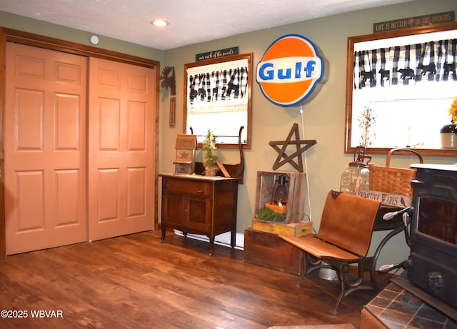 201 Richey St, Lock Haven, PA 17745 - sitting room with a wood stove, wood finished floors, recessed lighting, and healthy amount of natural light