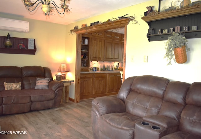 201 Richey St, Lock Haven, PA 17745 - living area with a wall mounted AC, a chandelier, and light wood finished floors