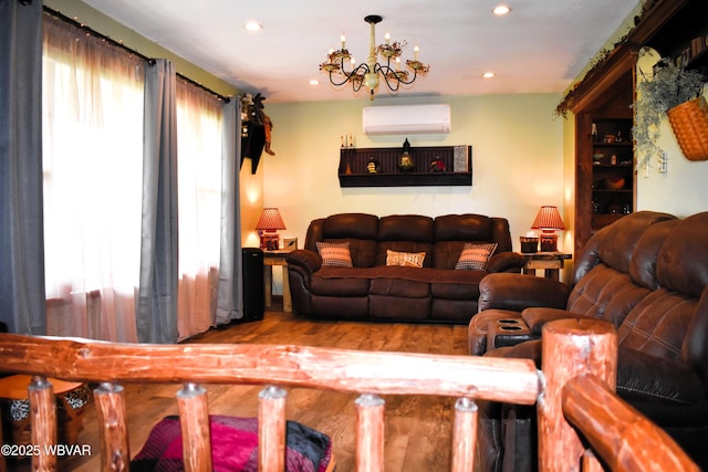 201 Richey St, Lock Haven, PA 17745 - living area featuring a wall unit AC, recessed lighting, a chandelier, and wood finished floors