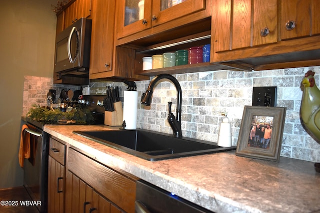 201 Richey St, Lock Haven, PA 17745 - kitchen featuring a sink, range with electric cooktop, brown cabinetry, backsplash, and glass insert cabinets