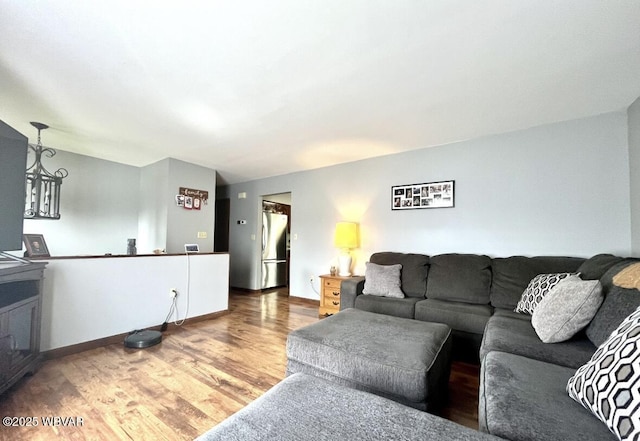 150 Pine Creek Ave, Jersey Shore, PA 17740 - living room with wood finished floors and a chandelier