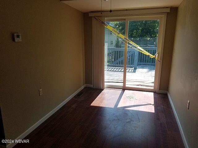 doorway to outside with dark hardwood / wood-style floors