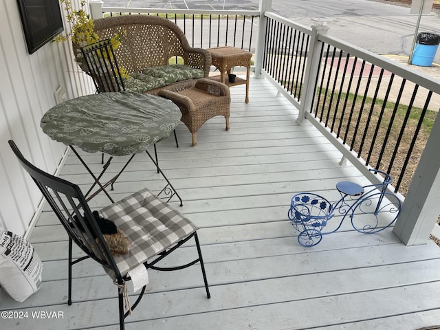 wooden terrace featuring a porch