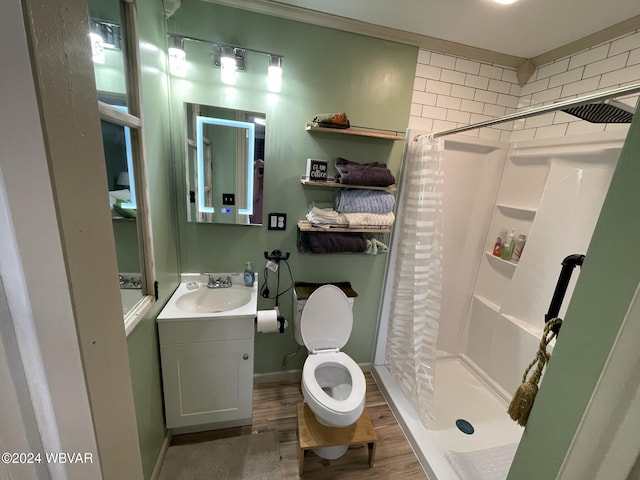 bathroom with vanity, toilet, a shower with shower curtain, and hardwood / wood-style flooring