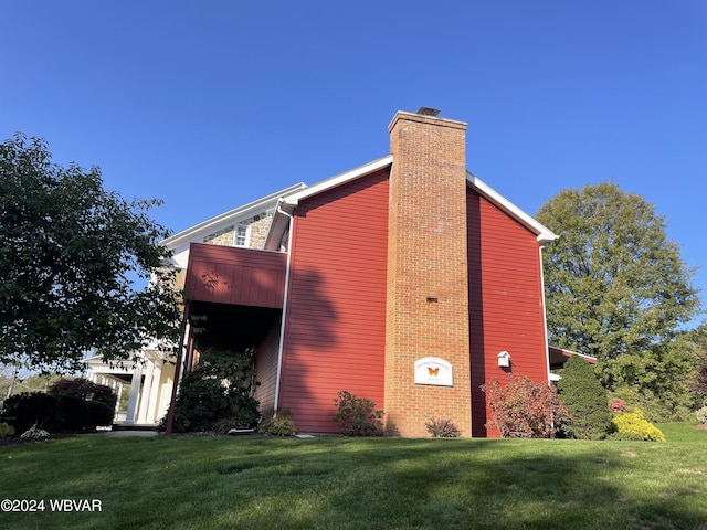 159 Harveys Ln, Milton, PA 17847 - view of home's exterior with a chimney and a lawn