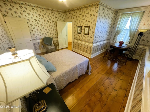 bedroom with dark wood-type flooring