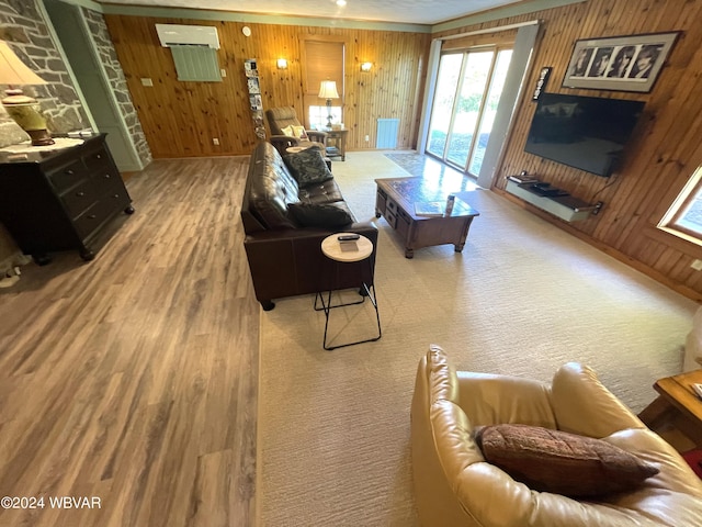 living room featuring hardwood / wood-style flooring and wood walls