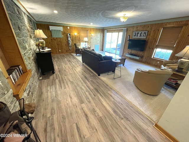 living room featuring wooden walls and wood-type flooring