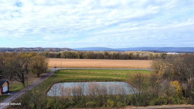 aerial view featuring a rural view and a water and mountain view